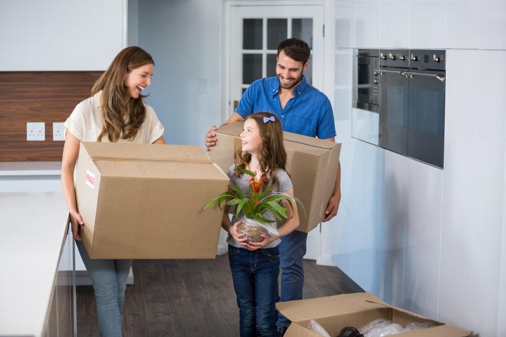 Family with moving boxes
