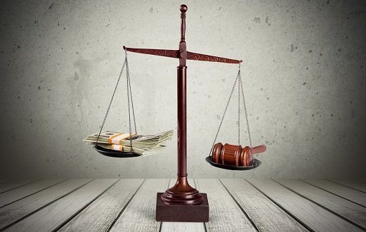 Money and scale of justice
