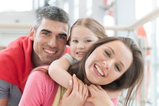 Young happy family in shopping mall